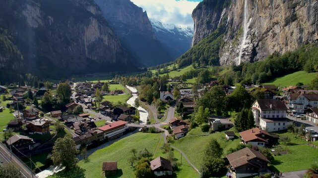 Beautiful aerial footage of Lauterbrunnen, a Swiss Alps valley with stunning cliffs, Staubbach and Tr&uuml;mmelbach Falls. A cable car from Stechelberg leads to Schilthorn, offering breathtaking views.
