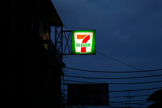Bangkok, Thailand - July 22, 2022: Closeup view of a 24h 7-Eleven convenience store during night time.
