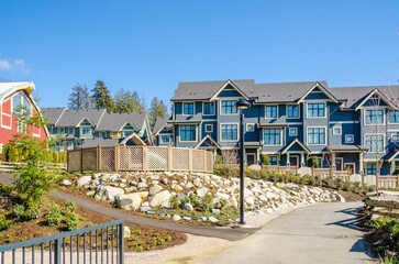 Fototapeta premium Two story luxury house with beautiful summer landscape in Vancouver, Canada, North America. Day time on June 2024.