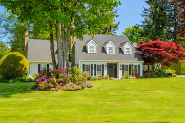 Two story luxury house with beautiful summer landscape in Vancouver, Canada, North America. Day time on June 2024.