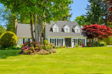 Two story luxury house with beautiful summer  landscape in Vancouver, Canada, North America. Day time on June 2024.