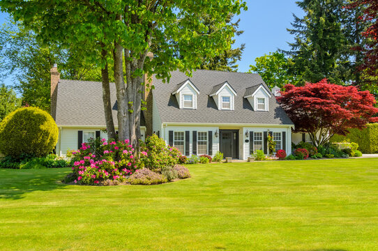 Two story luxury house with beautiful summer  landscape in Vancouver, Canada, North America. Day time on June 2024.