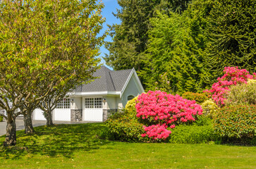 Two story luxury house with beautiful summer  landscape in Vancouver, Canada, North America. Day...