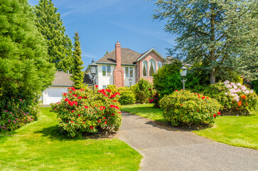 Two story luxury house with beautiful summer  landscape in Vancouver, Canada, North America. Day...