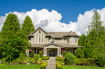 Two story luxury house with beautiful summer  landscape in Vancouver, Canada, North America. Day time on June 2024.