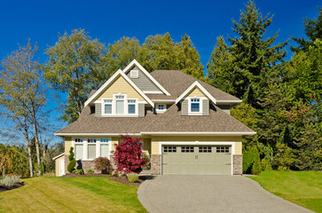 Two story luxury house with beautiful summer  landscape in Vancouver, Canada, North America. Day time on June 2024.