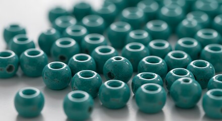 Teal Round Beads Scattered on White Background Close Up