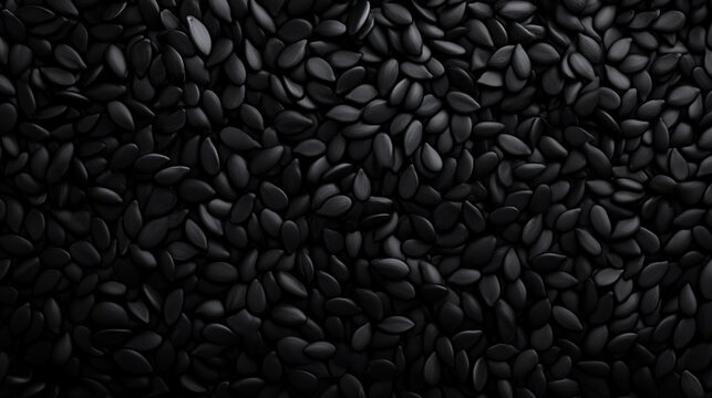 Abundant black sesame seeds falling against a dark background for culinary and design purposes