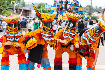Loei,Thailand -July 7 2024  Phi Ta Khon festival Ghost mask and colorful costume Fun Traditional...