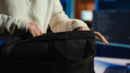 Computer scientist unpacking laptop bag, preparing to design and develop software applications. IT...
