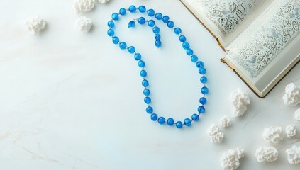 Prayer beads, Quran, white background