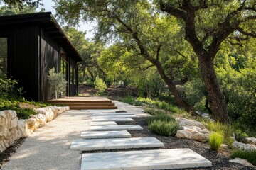 Charming modern pathway leads to a black wood cabin surrounded by lush greenery in a tranquil outdoor setting during the day