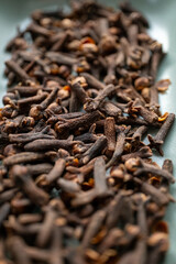 dried clove grains in bowl in close-up	