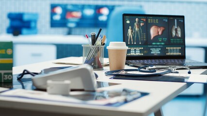 Empty medical office with computer and diagnostic tools set up for professional consultations, x...