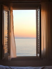 A seaside sunset from an open window offers a relaxed and timeless view
