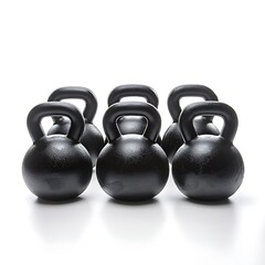 A collection black kettlebells, each with a smooth rubber finish and ideal for workouts The kettlebells are isolated on white background