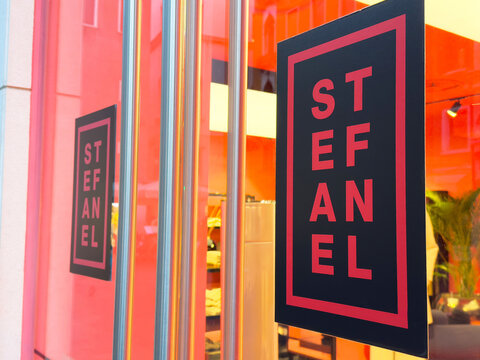 Stefanel storefront signage with vibrant red and black design