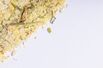 A triangular arrangement of herbal tea and salt, emphasizing texture and natural elements on a...