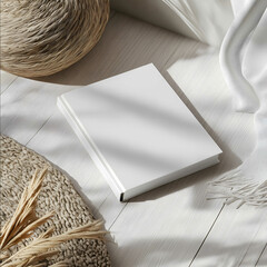 mockup of softcover book din a5 with rounded corners laying in trendy teenagers room from above bright cosy