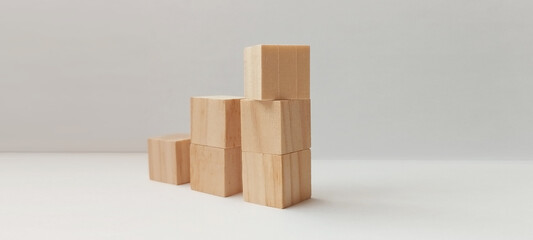 Building blocks stacked in minimalist studio wooden cubes arrangement modern design neutral background