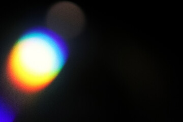 Colorful neon holographic light leaks on black background