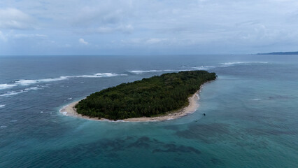 Aerial view of white waves coming to Cayo Zapatilla shore. Bocas del Toro archipelago, Panama, Caribbean, Central America.