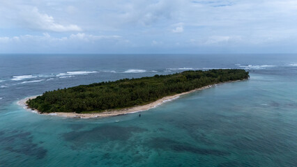 Aerial view of white waves coming to Cayo Zapatilla shore. Bocas del Toro archipelago, Panama, Caribbean, Central America.