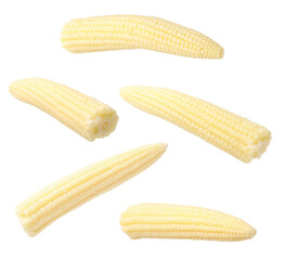 Yellow baby corn cobs in air on white background