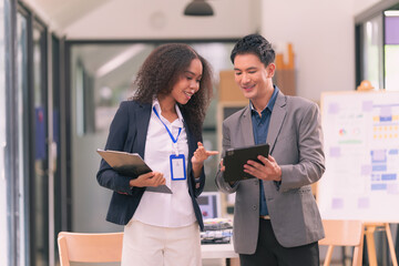 Creative team discussing ideas in business meeting In a productive and multi-ethnic office worker environment, engage in strategic business marketing discussions. Habits