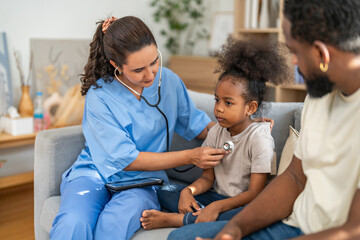 Fototapeta premium Doctor using stethoscope for medical checkup, listening to heartbeat and lungs of african child, father sitting beside, concept of pediatric healthcare, illness prevention, diagnosis and patient care