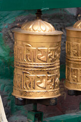 Prayer wheels is spun by devotees to aid for meditation and accumulating wisdom, good karma and putting negative energy aside
