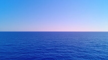 Sunrise Over Ocean Concepts Vast blue ocean under a clear sky at sunset.