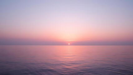 Naklejka premium A serene sunset over the peaceful sea with soft lavender, peach, and pink tones melting into the calm water below