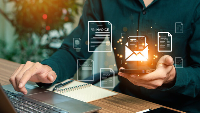 E-Invoice and Digital billing concept, Businessman using laptop to manage electronic statements on virtual screen. E-tax, Digital receipt, Online invoice processing and tax accounting solutions. - Powered by Adobe