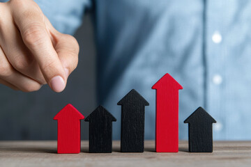 senior hand adjusting red wooden arrow among black arrows, symbolizing growth and progress