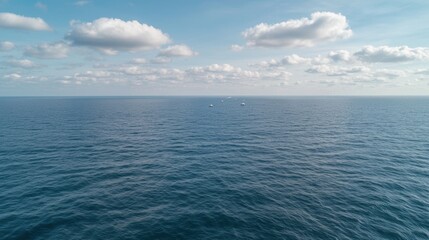 Obraz premium Wide ocean view with small boats, clear sky. Possible use Stock photo for travel or nature themes