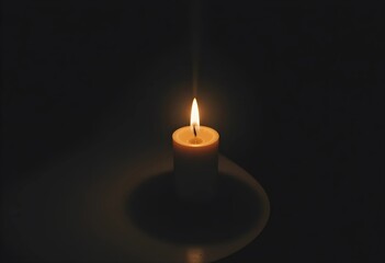 Fototapeta premium A candle with a flickering flame in a dim environment. Warm light casts soft shadows, creating a calm and intimate atmosphere. A minimalist composition emphasizing warmth, tranquility, and relaxation.