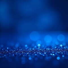 Abstract royal blue background with glitter bokeh. Shimmering sapphire crystals create dreamy texture. Light, sparkle create magical effect. Perfect for holiday, party luxury product presentation