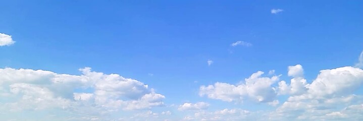 Cloudscape, Timelapse of a beautiful blue sky with fluffy white clouds, for a wide background	
