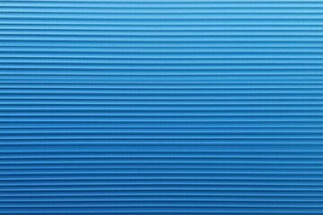 a close up of a blue wall with a white clock