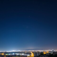  A Starry Night Sky Above an Urban Cityscape with Bright Lights and Distant Stars