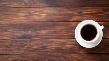 white cup of coffee sits on wooden table, creating warm and inviting atmosphere perfect for morning relaxation