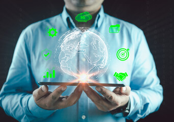 A Businessman is holding a virtual global connection glowing light. Business global internet connection application technology and digital marketing. Digital link tech, big data, business target.