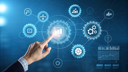 A hand points at a central gear icon on a digital interface, surrounded by interconnected gear icons and business charts.