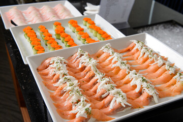 Salmon sushi with onion and mayonnaise on plate

