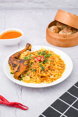 curry laksa with rice noodles and chicken. Laksa is a type of noodle dish with spices typical of Peranakan culture that combines Chinese and Malay. Asian traditional soup.