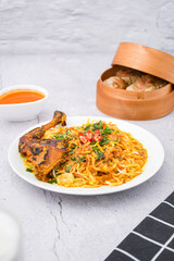 curry laksa with rice noodles and chicken. Laksa is a type of noodle dish with spices typical of Peranakan culture that combines Chinese and Malay. Asian traditional soup.