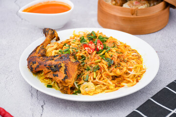 curry laksa with rice noodles and chicken. Laksa is a type of noodle dish with spices typical of Peranakan culture that combines Chinese and Malay. Asian traditional soup.