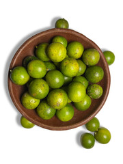 Close up of calamansi orange. Kasturi, sonkit, calamansi orange, or calamondin is a type of citrus fruit that grows rapidly in Bengkulu, smells fragrant, and has a sour taste.