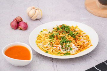 curry laksa with rice noodles. Laksa is a type of noodle dish with spices typical of Peranakan culture that combines Chinese and Malay. Asian traditional soup.